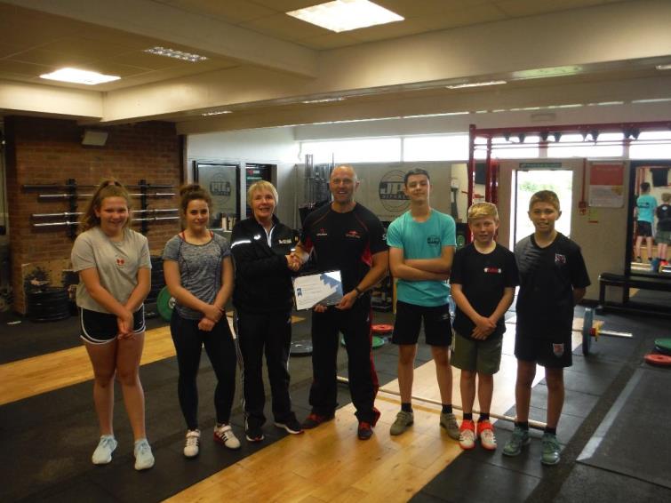 Angela Miles and Simon Roach with members of Strength Academy Wales 